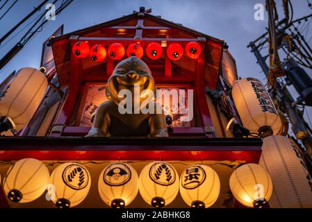 Osaka, Japan - March 21, 2017: Gentle monster overlooking the entrance of a restaurant, taken at dusk in Osaka. Stock Photo