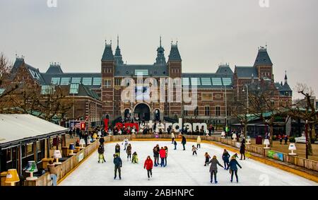 Amsterdam Holland December 2018 winter scating outdoors on the frozen pond in front of the Rijksmuseum including the white drawbridge specialy made fo Stock Photo