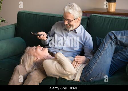 Elderly couple laughing spending free time together at home Stock Photo