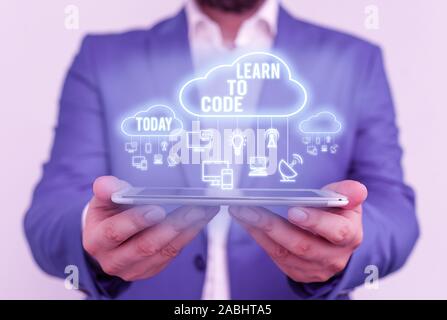 Handwriting text Learn To Code. Conceptual photo Learn to write Software Be a Computer Programmer Coder Stock Photo