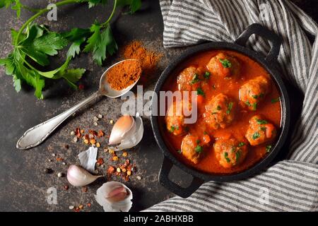 Spicy meatballs in tomato sauce, a typical Spanish and Mexican bar food, so called albondigas Stock Photo