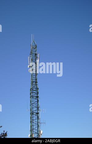 Receiving antennas and stations to maintain the mobile telephone network with the blue sky in the background Stock Photo