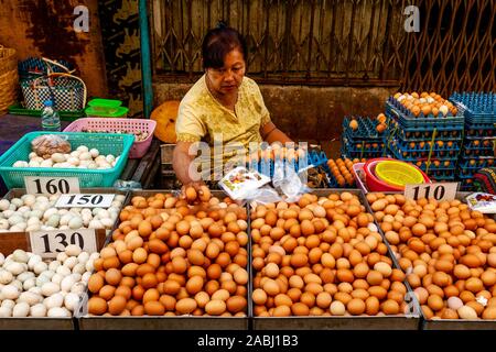 A Local Woman Sells Fresh Eggs At The 26th Street Market, Yangon, Myanmar. Stock Photo