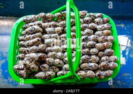 A Basket Of Boiled Quails Eggs For Sale On The Yangon Circle Line Train, Yangon, Myanmar. Stock Photo