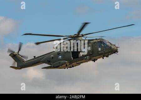 The Royal Navy Merlin HC3 helicopter took part in the commando assault demonstration at the RNAS Yeovilton Air Day, UK held on the 13th July 2019. Stock Photo