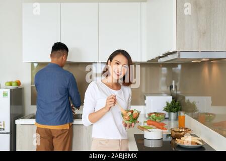 Young couple spending morning time together in their kitchen at home Stock Photo