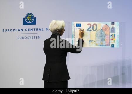 (191128) -- BEIJING, Nov. 28, 2019 (Xinhua) -- New President of the European Central Bank (ECB) Christine Lagarde writes her signature on a 20 Euro display banknote at the ECB headquarters in Frankfurt, Germany, Nov. 27, 2019. Christine Lagarde on Wednesday signed euro banknotes, vowing to nurture and sustain EU citizens' trust in the single currency. FOR EDITORIAL USE ONLY. NOT FOR SALE FOR MARKETING OR ADVERTISING CAMPAIGNS. (Angela Morant/ECB/Handout via Xinhua) Stock Photo