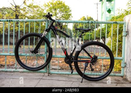 Bicycle Locked to a Fence-Security and Anti-Theft Stock Photo