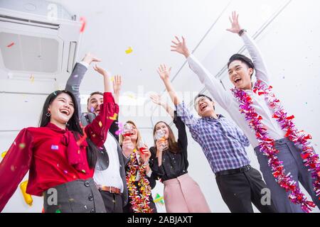 Business winner team gladful party greeting celebration in office all people hand rise up high. Stock Photo