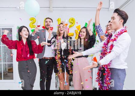 Business people greeting party in the office enjoy new year celebration. Stock Photo