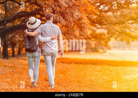 couple lover people have a good memory for walking relax in the park in autume season. Stock Photo