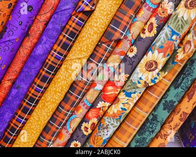 Display of Colourful Bolts of Fabric in a Fabric Store. Stock Photo