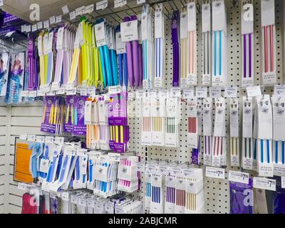 Knitting Needles and Crochet Hooks on Display in a Craft Store. Stock Photo