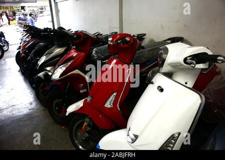 Antipolo City, Philippines – November 26, 2019: Assorted motorcycles and scooters on display at a motorcycle store. Stock Photo