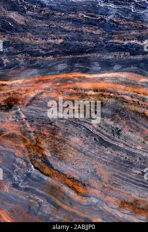 Folda Quartsite stone texture vertical image. Colorful surface with stripes, Polished metamorphic Stone Background, abstract stone surface with curved Stock Photo