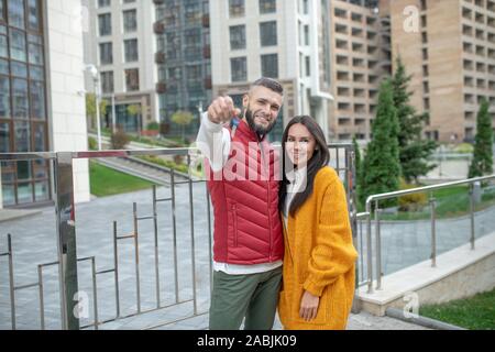 Delighted happy couple showing you the keys Stock Photo