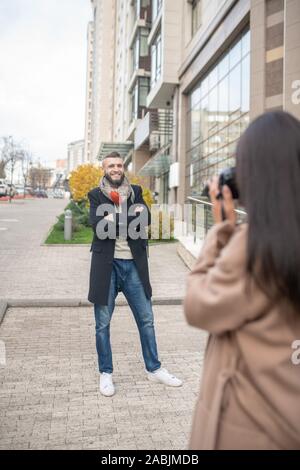 Beautiful nice woman holding a professional camera Stock Photo