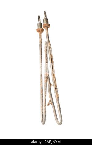 Old worn out immersion heating element cracked and covered with limescale. Isolated on white background. Vertical orientation. Stock Photo