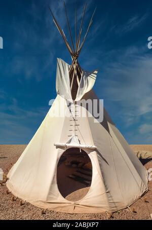 Traditional Ute tipi (teepee) a traditionally made of animal skins and wooden poles with smoke flaps at the top. Utah, USA Stock Photo