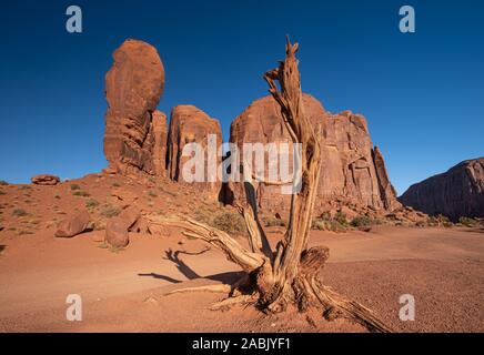 Monument Valley region of the Colorado Plateau with vast sandstone buttes on the Arizona–Utah border, in a Navajo Nation Reservation. USA Stock Photo