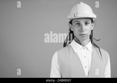 Young man construction worker in black and white Stock Photo