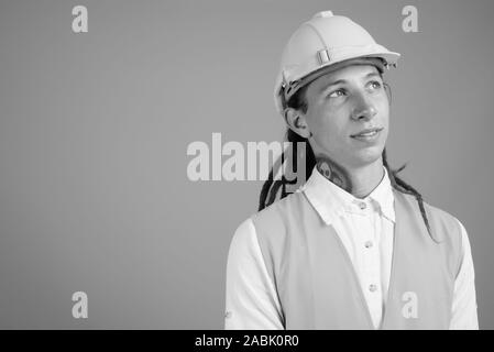 Young man construction worker in black and white Stock Photo