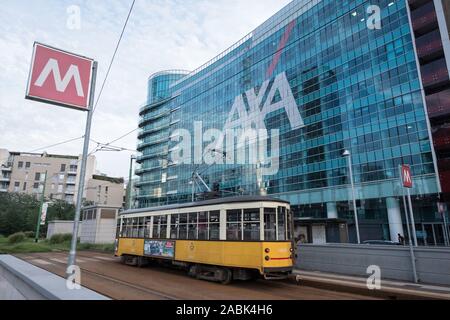 Italy, Milan: tram in front of the AXA skyscraper, French multinational insurance firm, in the District Porta Nuova Stock Photo