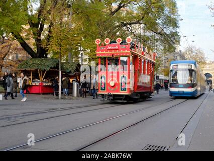 The Marlitram streetcar, a Christmas festive tram going through the city centre passing a regular tram on market in Zurich, Switzerland, Stock Photo