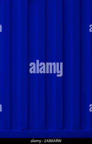 container detail background corrugated blue. Blue deep colors with metal parts. Background, Wallpaper. Nobody, vertical shot. Straight lines, mininal, Stock Photo