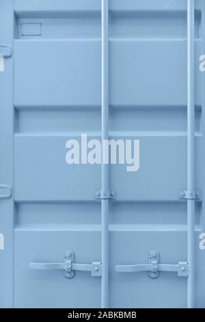 Shipping container door in baby blue tint. Cute pastel colors with metal parts. Background, Wallpaper. Nobody, vertical shot. Straight lines, mininal, Stock Photo