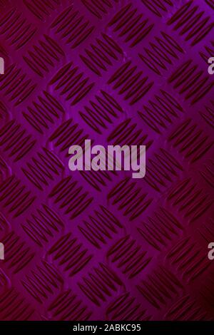 Colorful neon diamond textured steel background. Deep pink purple colors with a color changing effect. Vertical shot, Wallpaper style. Decoration Stock Photo