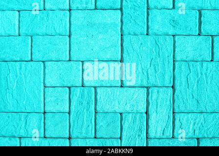Highly detailed street pavement background with geometric pattern made of square blocks of different sizes with textured rough surface toned in turquo Stock Photo