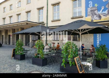 Outdoor seating in front of the kiosk 'Pioniere 37' in the congress building of the Deutsches Museum at the Ludwigsbrücke. [automated translation] Stock Photo