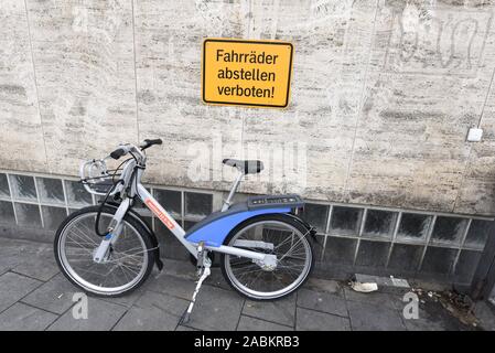 MVG rental bicycle parked under a prohibition sign 'wild' in Munich. [automated translation] Stock Photo