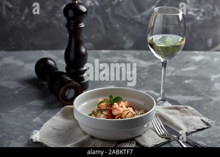 Rice noodles with shrimps and seafood, spicy asian style noodles in bowl Stock Photo