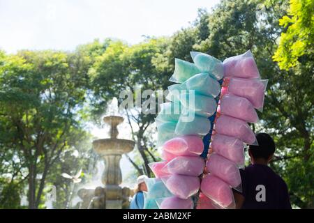 seller of cotton candy in plastic bags Stock Photo