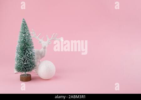 Creative layout made of Christmas decorations on pink. Holiday background. Stock Photo
