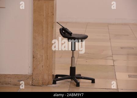 Symbolic empty chair of a supervisor at a protest action of the works council at the Haus der Kunst against the planned staff reduction by outsourcing the areas of supervision, cash desk and gate. [automated translation] Stock Photo