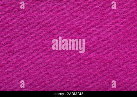 bright pink fine grain felt fabric. fiber texture polyester closeup. pink fleecy background. shaggy surface. Stock Photo