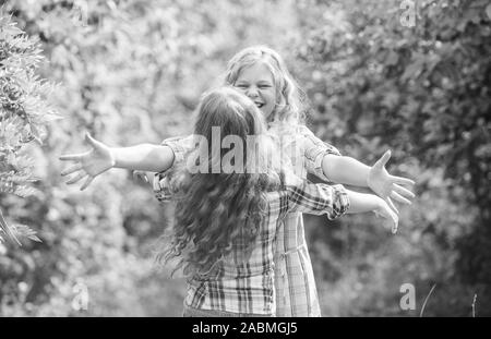 Happy reunion concept. Best friends forever. Happy kids running meet each other. Sincere emotions. My dear friend. Happy girls excited see each other. Give me hug. Glad to meet you. Finally together. Stock Photo
