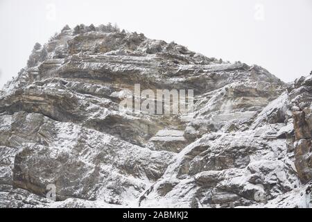 Snow covered, forested mountain peak on a cloudy winter day in Provo Canyon, Utah. Stock Photo