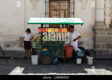 cart with fruit in colonial city Stock Photo
