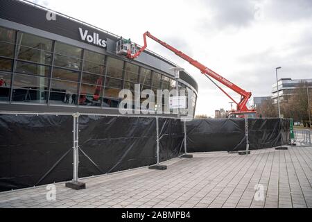 Brunswick, Germany. 28th Nov, 2019. Workers put plates in front of the hall name. At the sponsor's request, the 'Volkswagen Halle' lettering will be concealed during the AfD federal party congress. The AfD is holding its federal party conference in Braunschweig from 30 November to 1 December. Credit: Sina Schuldt/dpa/Alamy Live News Stock Photo