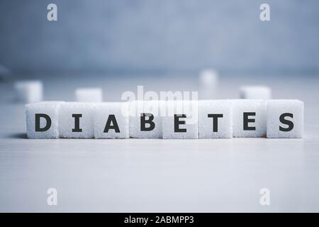 diabetes word in crossword style on sugar block letters background in health care and healthy nutrition concept Stock Photo