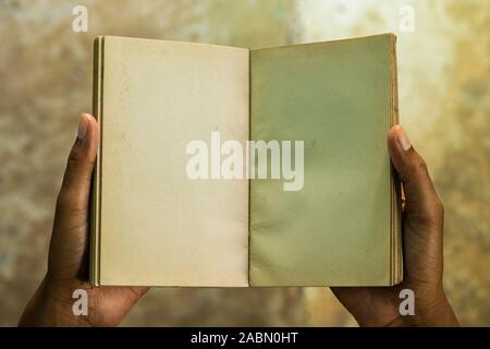 hand holding an open book Stock Photo