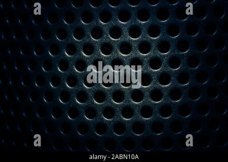 Dark navy blue speaker lattice background, close-up Stock Photo