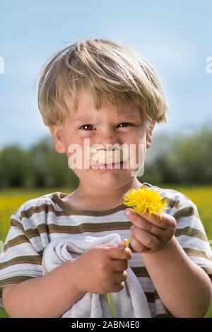 Little boy with a peg under his nose Stock Photo