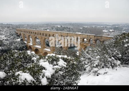 Pont du Gard Roman Aqueduct or Bridge Under Snow in Winter Gard Département France Stock Photo
