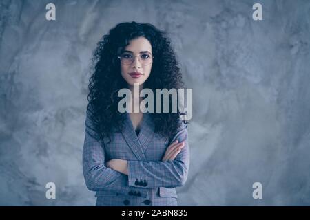 Portrait of her she nice-looking attractive charming lovely chic content calm wavy-haired girl marketer financier folded arms isolated over gray Stock Photo