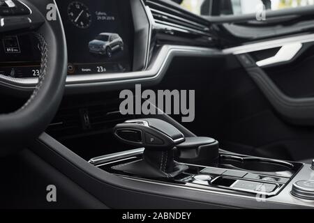 A fragment of the modern car saloon and a gearbox in an expensive car. Stock Photo